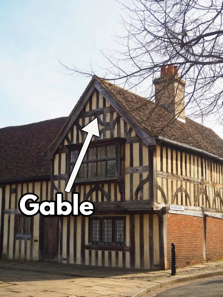 A gable is the triangular space on a wall at the end of a pitched (i.e. angled) roof.