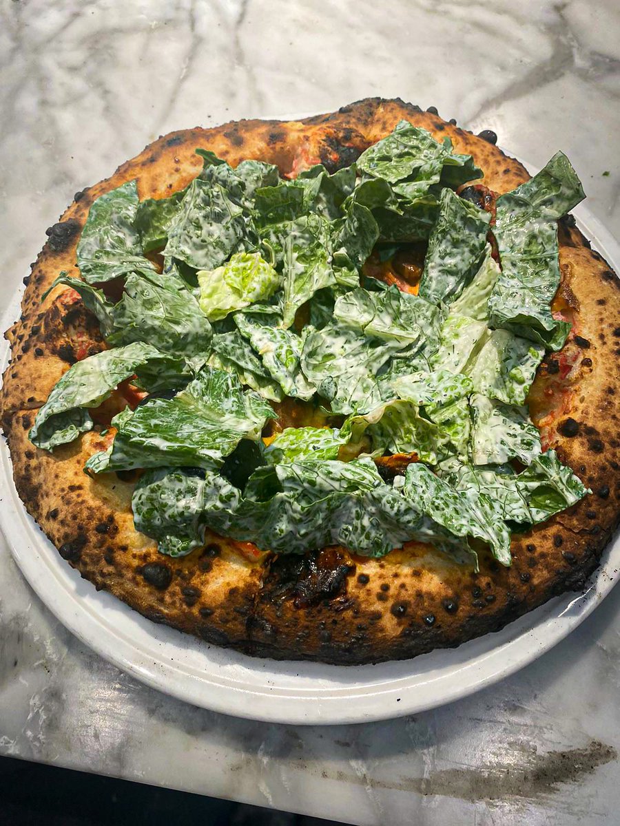 New Pizza of the Moment 🤩 The Cobb Salad Pizza • little gem, tomato, bacon, feta, eggs, ranch. Available at Fordo's for a limited time. Created by Chef Jim Herdler 👨‍🍳