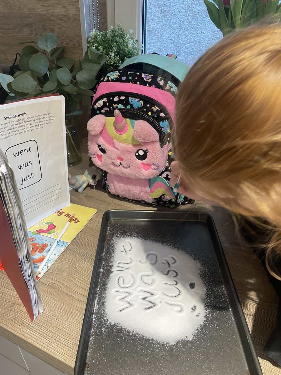 J2302Laura's tweet image. We used a tray with salt on it for E to do her words for homework tonight @BPSPrimary1W #makelearningfun