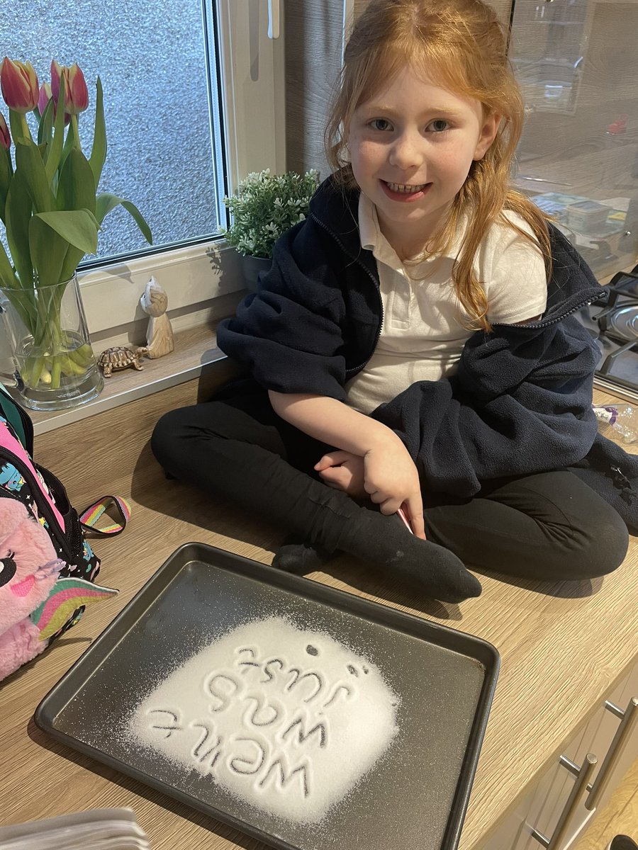 J2302Laura's tweet image. We used a tray with salt on it for E to do her words for homework tonight @BPSPrimary1W #makelearningfun