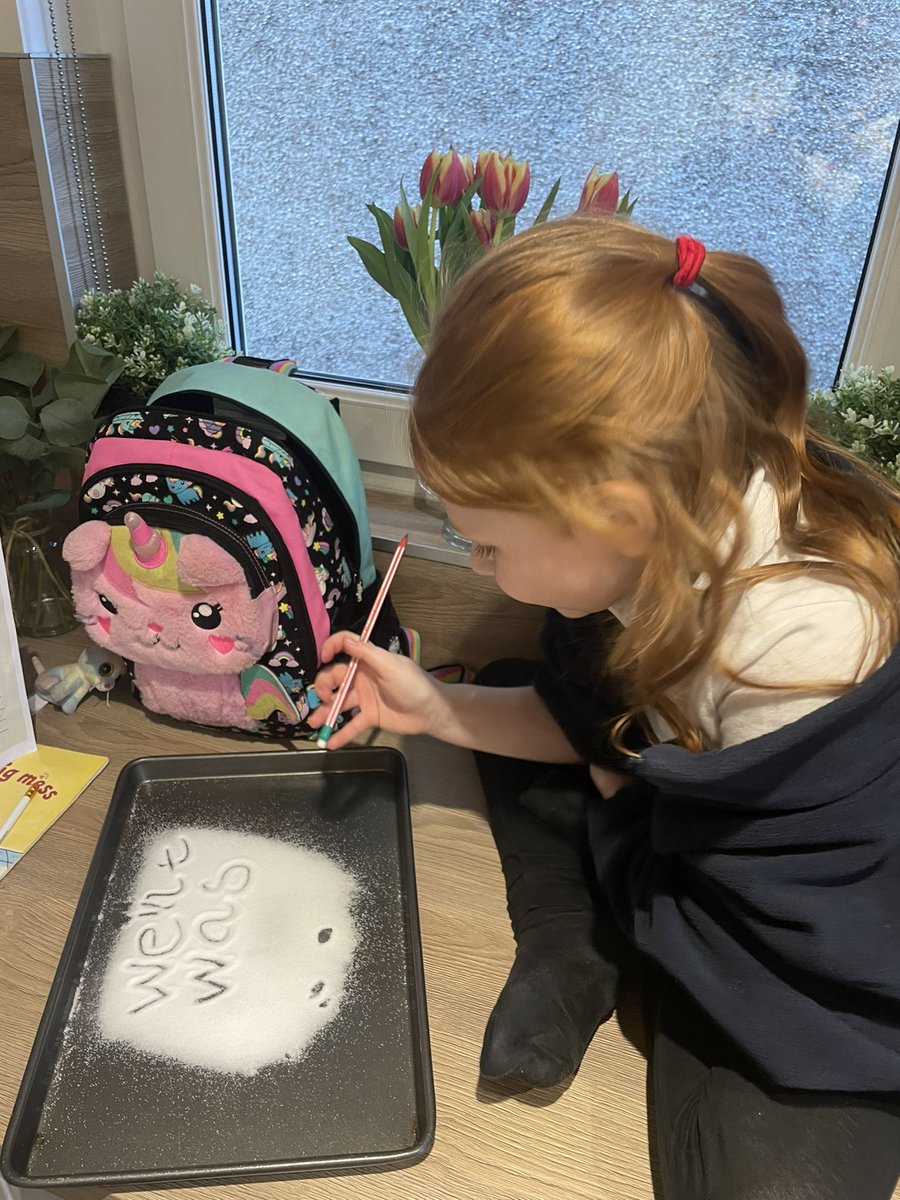 J2302Laura's tweet image. We used a tray with salt on it for E to do her words for homework tonight @BPSPrimary1W #makelearningfun