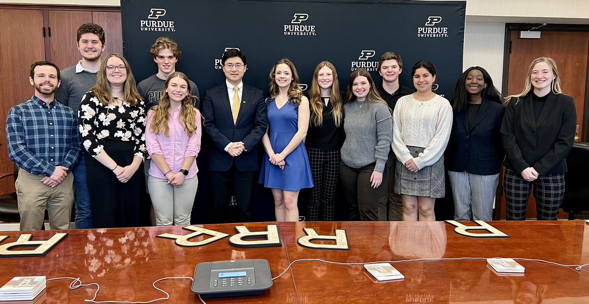 PurduePresident's tweet photo. Carrying on #Purdue traditions and driving the Boilermaker Special forward. Signing the “R Board" for Purdue @ReamerClub new members, many are freshman. This month we will admit regular decision applications. #BoilerUp! 🚂 https://t.co/JolzeKnSEO