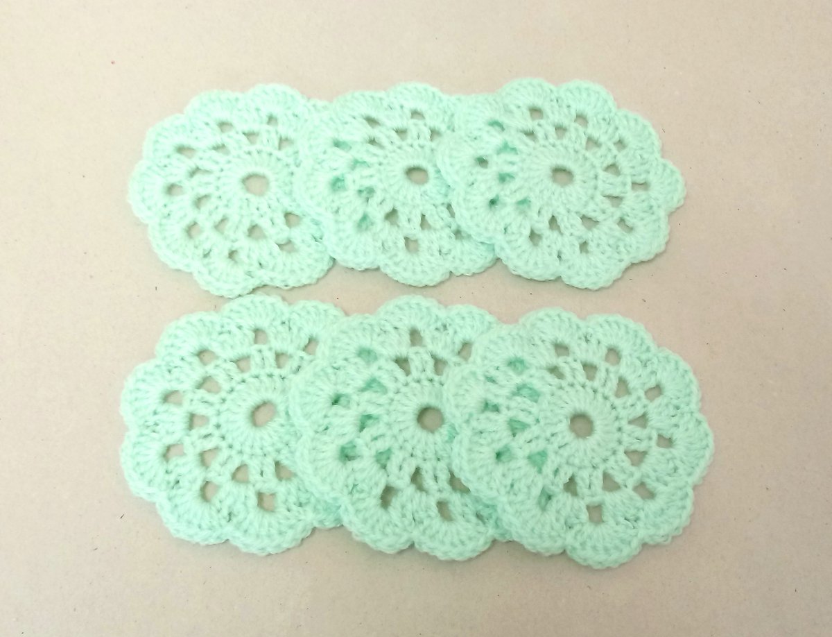Six flower coasters in mint green, a lovely gift idea. 
#crochetcoasters #coasterset #handmadeintheuk #newonfolksy #handmade folksy.com/items/8102336-…