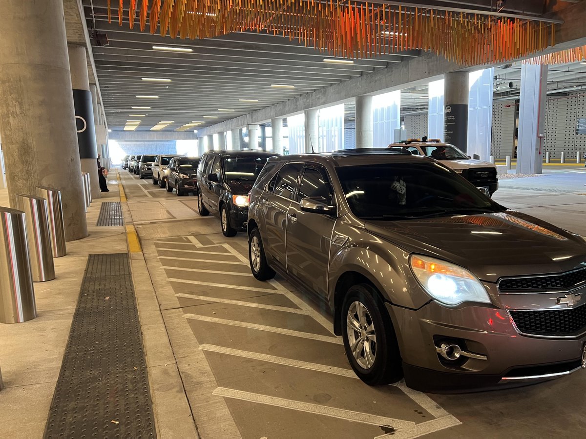 THIS is why they're seeing back-up problems at the new <a href="/Fly_KansasCity/">Kansas City International Airport</a> people! People are LEAVING THEIR CARS &amp; roaming inside. What?!??!? They're going to start towing these ding-a-lings.  There is no more 'float and wait' like before at the old KCI.  GO TO THE CELL PHONE LOT.