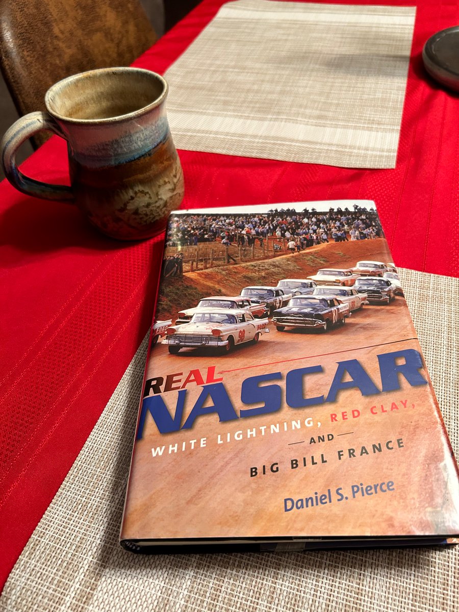 me_cougar's tweet photo. Ending the day on a high note. One of my favorite books LOADED with history and a nice cup of black coffee. #nascar #gargeguys #coffee #kylebusch #doorbumperclear https://t.co/KUDNeFLvh5