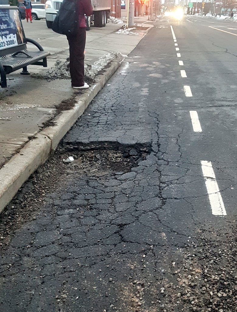 Serious injury could result from a cyclist either riding into this huge pothole or being struck by a motorist trying to avoid it. 
It's at King &amp; Longwood, <a href="/cityofhamilton/">City of Hamilton</a>.
<a href="/CycleHamilton/">Cycle Hamilton</a> #HamOnt311