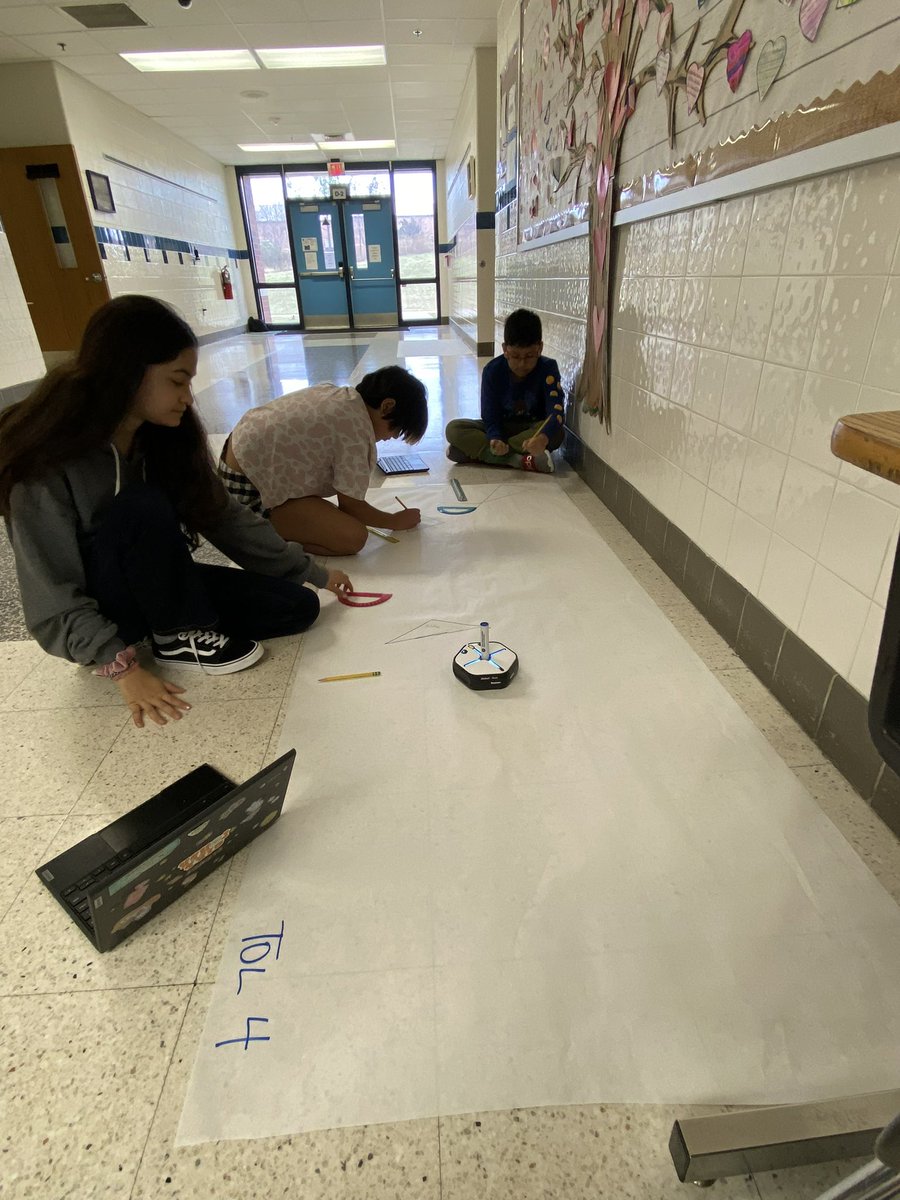 Our 5th graders coded Root robots to draw different types of triangles and measured sides and angles to compare!