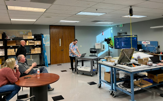 A glimpse into X2nSat's R&amp;D process. Here data scientist Cameron demonstrates to the team how we're able to efficiently pull data from rural weather stations, transport it over the satellite link, and securely deliver it to the client's database.
