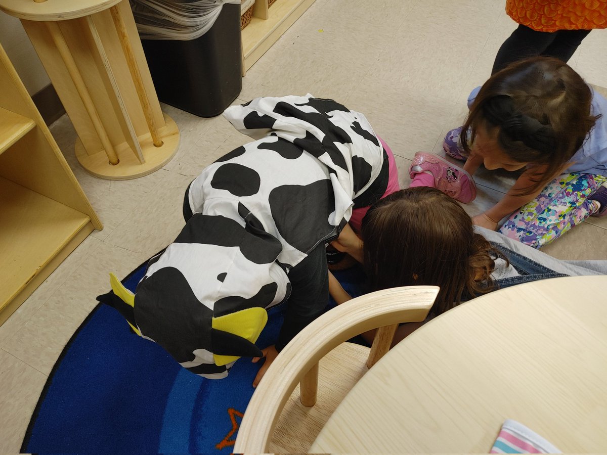 PreKTustin's tweet photo. Can you tell what our new unit is? Dramatic play has turned into a dairy farm! Can't say I've ever seen our cow costume and baby bottles used this way 😅 https://t.co/8vwbxeGvfO
