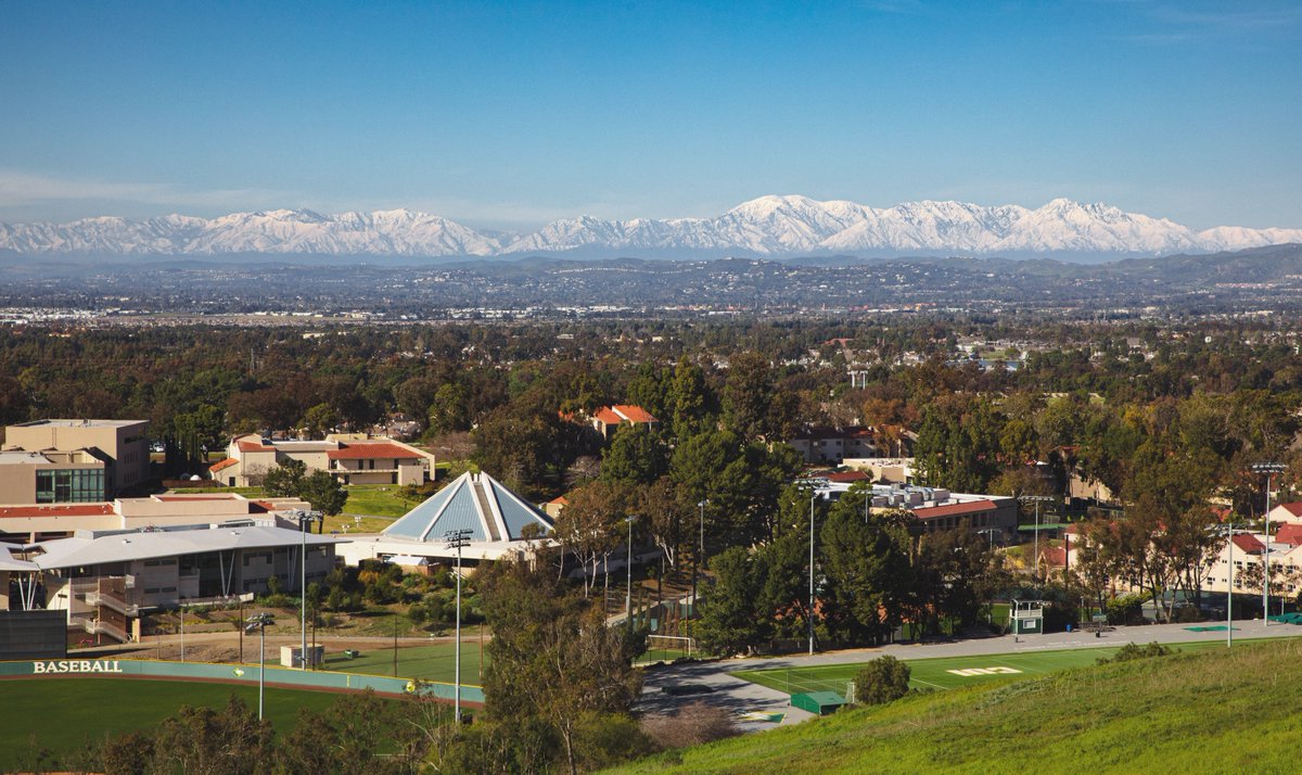 Snow and sun! 📸 Taken from the top of French Hill, this picture features the baseball field and our newly renovated track, with Grimm Hall, the Borland-Manske Center, CU Center, and dorms. A clear sky allowed a rare sighting of our local mountains, covered in snow!