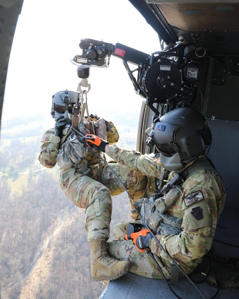 Army_Aviation's tweet photo. U.S. Soldiers with the 28th Expeditionary Combat Aviation Brigade train with hoists on UH-60 Black Hawk helicopters at Muir Army Airfield, Feb 24, 2023. (U.S. Army National Guard photo by 2nd Lt. Kate Kramer) https://t.co/oth8156pST