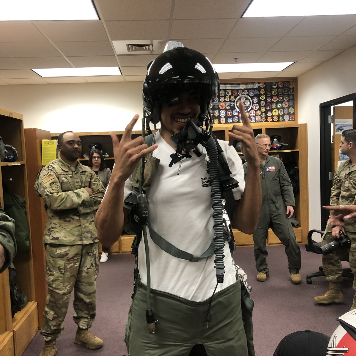USAA's tweet photo. @USAA hosted @spurs point guard @Tre3Jones at the 149th Fighter Wing at JBSA-Lackland AFB today. He presented the unit with a signed jersey, tried on a flight suit and helmet, toured an F-16, and signed autographs.

Check out more at https://t.co/ESLPBG0ShJ https://t.co/qqmYRGzlyb