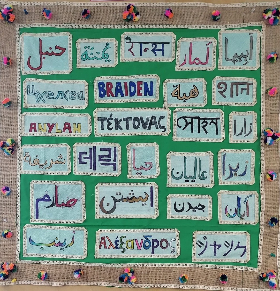 MsBashir12's tweet photo. After reading The Arabic Quilt, 56-1 decided to make their own mini name quilt in their 1st languages (Arabic, Urdu, Korean, Japanese, English, Greek, Hindi, Bengali, Serbian) @PLRobertsonPS https://t.co/uAyaCyDZ6s