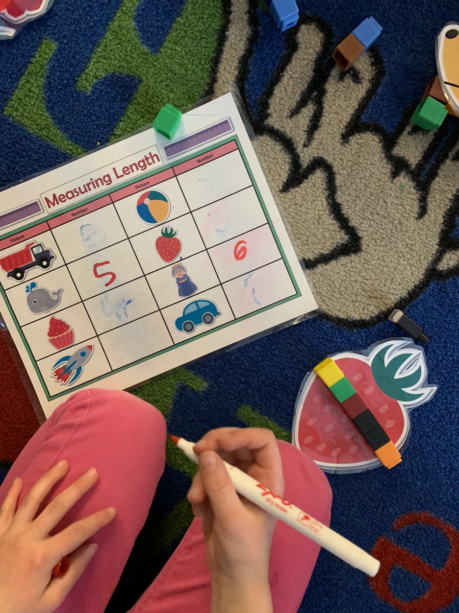 Continuing our exploration of non-standard units in #math by using unifix cubes to #measure! We are careful to print our numbers correctly! #kindergarten