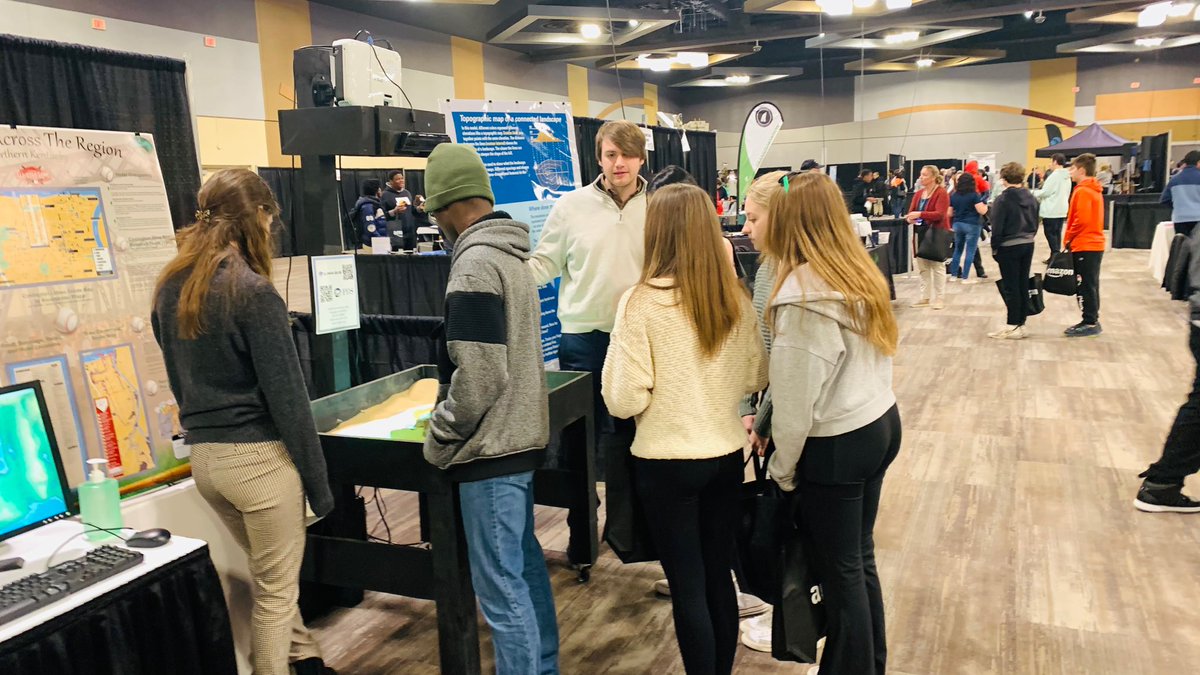 HillYeah7's tweet photo. PDS and the #GIS team are engaging with students about career paths at the NKY Convention Center for the Inspire To Hire event. Having an interactive augmented reality sandbox to talk about #planning and #geospatial industries helps!!! #nky #career #jobs #SARndbox https://t.co/iVd9FXmdIX