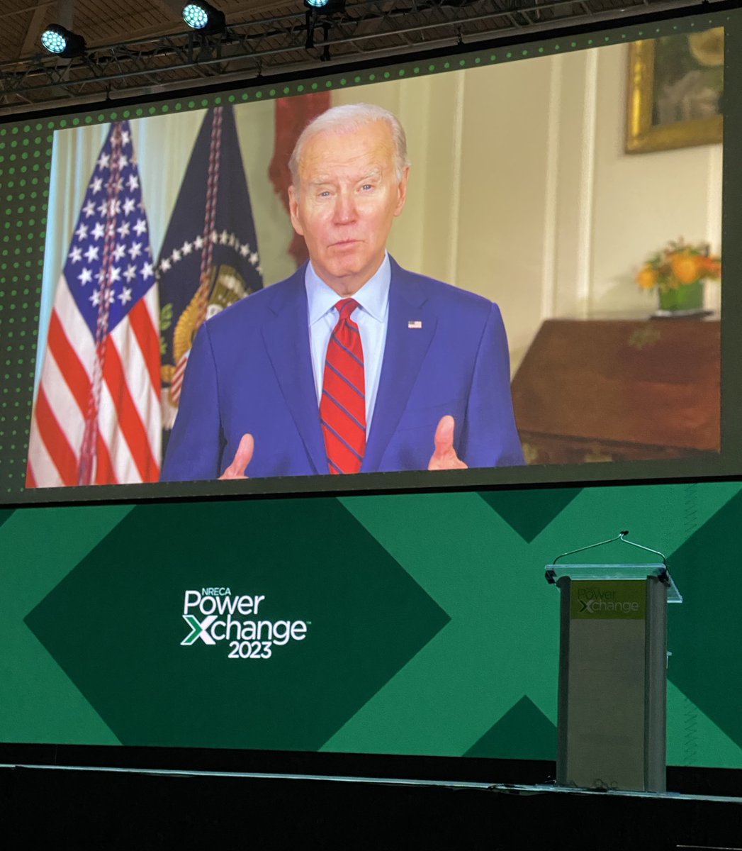 NRECANews's tweet photo. .@POTUS spoke by video to thousands of electric co-op leaders at #PowerXchange23. The president’s remarks outlined two significant policy wins secured by co-ops last year—direct access to energy tax credits and $9.7 billion for the co-op energy transition. https://t.co/135ud5cZdF https://t.co/e4jRjLKiGp