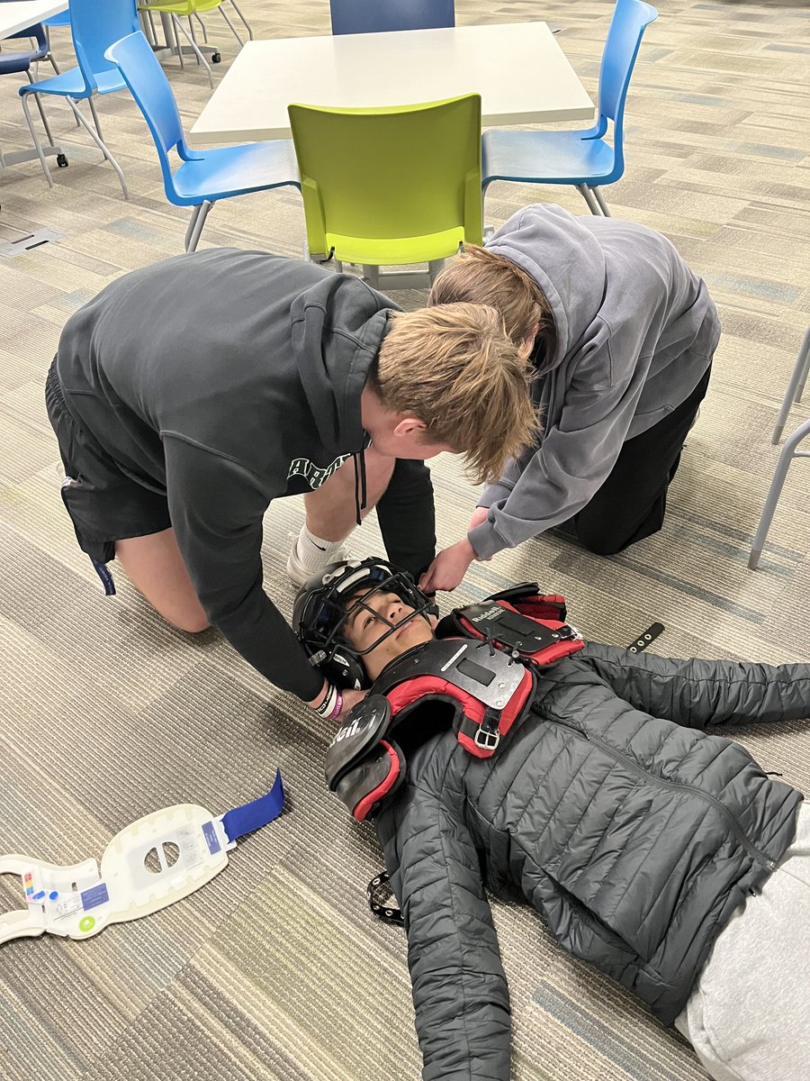 March is National Athletic Trainer month! Sports Medicine students celebrated by learning from Mrs. V and practicing C-spine stabilization and spine boarding and injured athlete. They did a great job!! @ShakopeeSchools