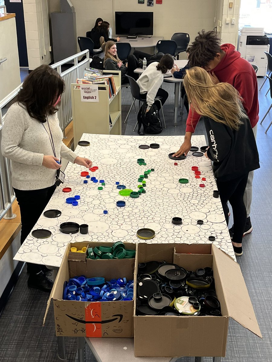 IHHSLibrary's tweet image. Thanks to UP Bio students for sharing their reclaimed bottle cap mosaic project in the library. Students are coming by to fill in the blanks and see what gets created! @ihupsmr #ArtInTheLibrary #Wellness #Collaboration