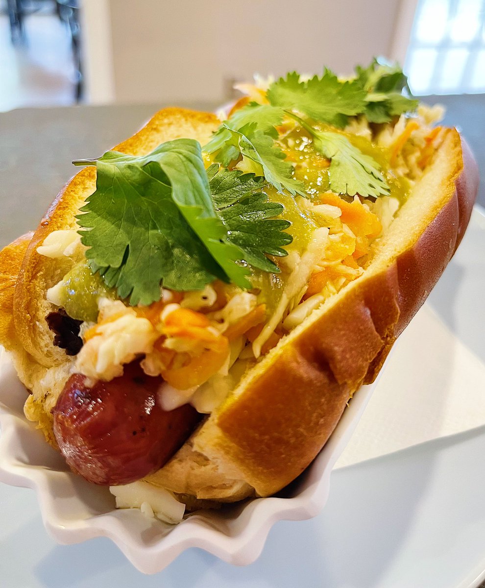 What’s good H-Town! Wanting to treat your tastebuds? Look no further. Now featuring our new dog of the day, the El Salvador dog! House refried black beans, Oaxaca cheese, curtido slaw, roasted tomatillo salada, and cilantro are sure to make your day extra tasty. #PatioWeather
