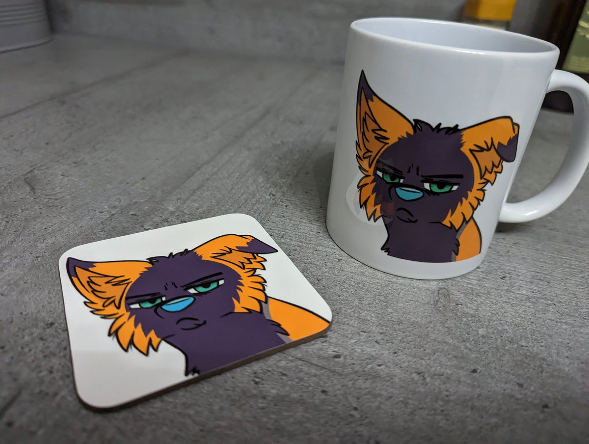 Varska's tweet photo. Another gift from @FelanEntane , absolutely spoiling me! Art by the amazing @Mogtaki 

I can match my fursona on my mug and mat every morning now

#furry #furryart #grumpy https://t.co/kTCBRiUgni