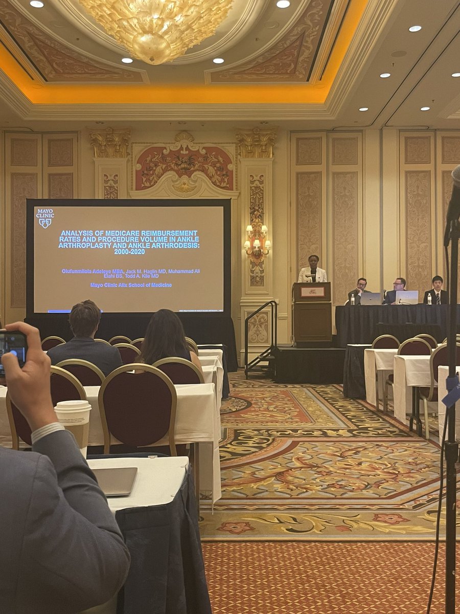 MayoAZOrtho's tweet photo. We love seeing our medical student Olufunmilola Adeleye on the podium at @AAOS1! She presents today on: Analysis of medicare reimbursement rates and procedure volume in ankle arthroplasty and ankle arthrodesis 2000-2020 https://t.co/i1mUorEiTP