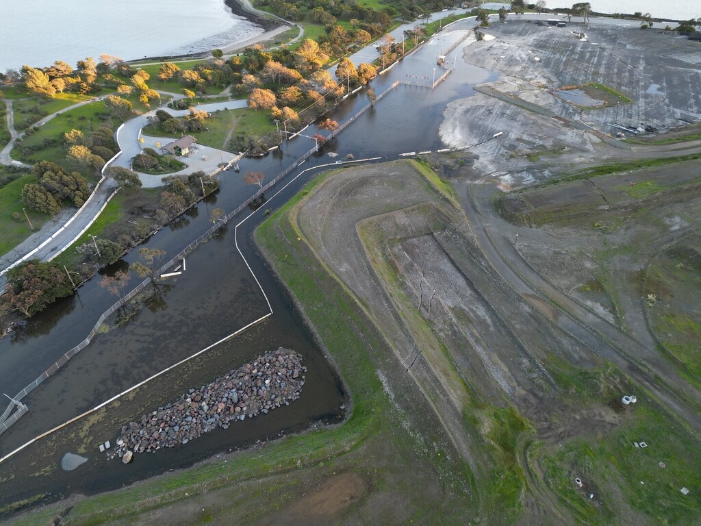 bayviewhillsf's tweet photo. Here is a aerial picture of Gilman Ave and Hunter's Point Expressway showing all the flooding. You can see the entrance to the state park blocked by the water. This water has been here for more than 2 months collecting pollutants and the city has failed … https://t.co/GdIq9hU4g3 https://t.co/fdyNcMwi0Z