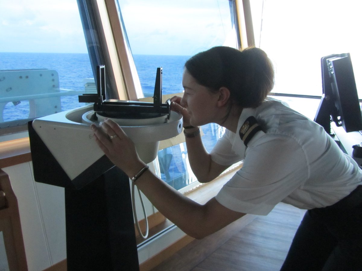 AMT_Ocean's tweet photo. Rachel Astell (3rd Officer, RRS Discovery) taking a compass bearing on station in the South Atlantic Ocean. Celebrating women in science on AMT30. @PlymouthMarine, @CLASS_UKRI, #AMT30, #NEODAAS, #embraceequity2023 https://t.co/J4RbqhW1He