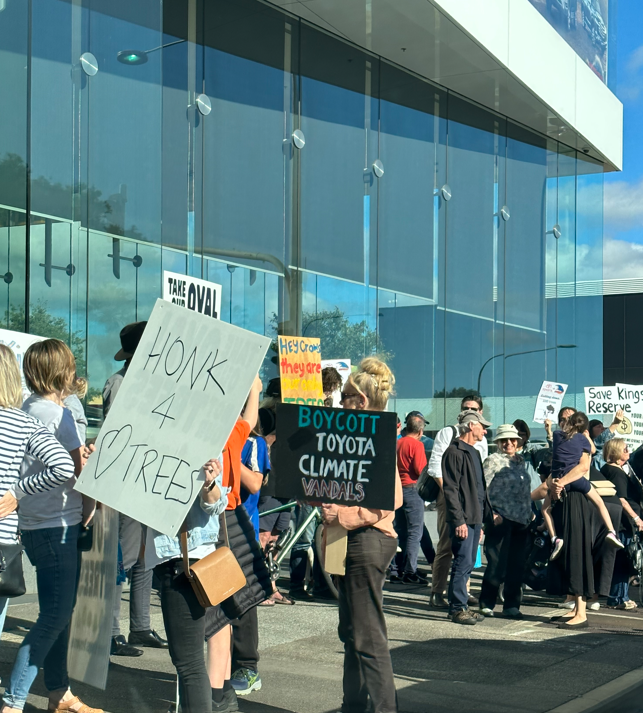 theTiser's tweet image. "Oh what a felling!" Protesters have gathered outside CMI Toyota on West Terrace to rally against the Crows HQ development on Kings Reserve in Torrensville. Latest on the plans: bit.ly/41S4Tzr