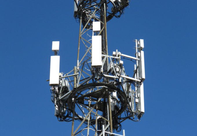 BT/EE and Three section of Tower. BT/EE Nokia equipment at the centre of the image with the Nokia Massive MIMO panel above the Commscope passive