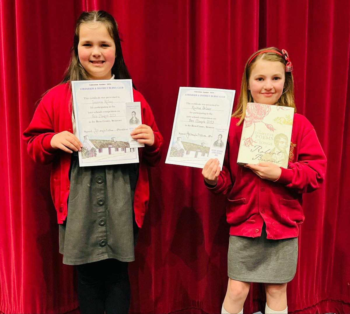 StJosephsRCPri1's tweet photo. P5 pupils, Joanna and Rubie, attended the Ryan Centre to participate in Stranraer and District Burns Club's annual Scots' Verse and Song Competition, on Wednesday 8 March. 

Both girls did absolutely fantastic, with Rubie finishing joint 3rd Place in the P3-5 Singing category! https://t.co/jBZZ7XoWD0