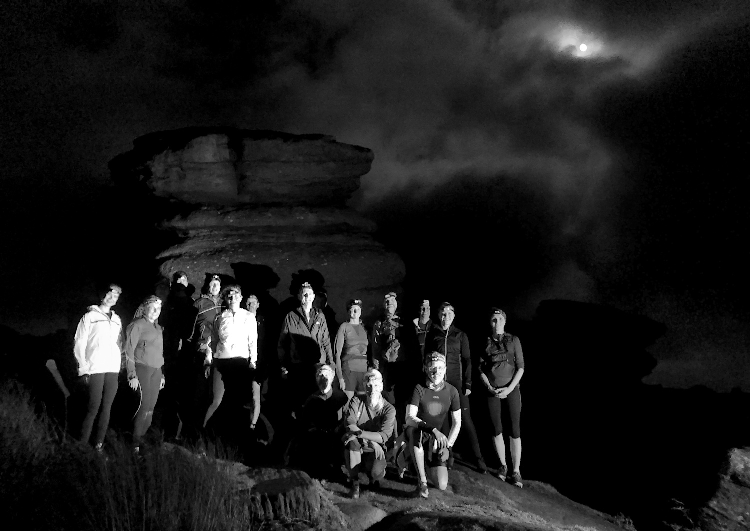 Night fell runners under a moonlit sky at Burbage