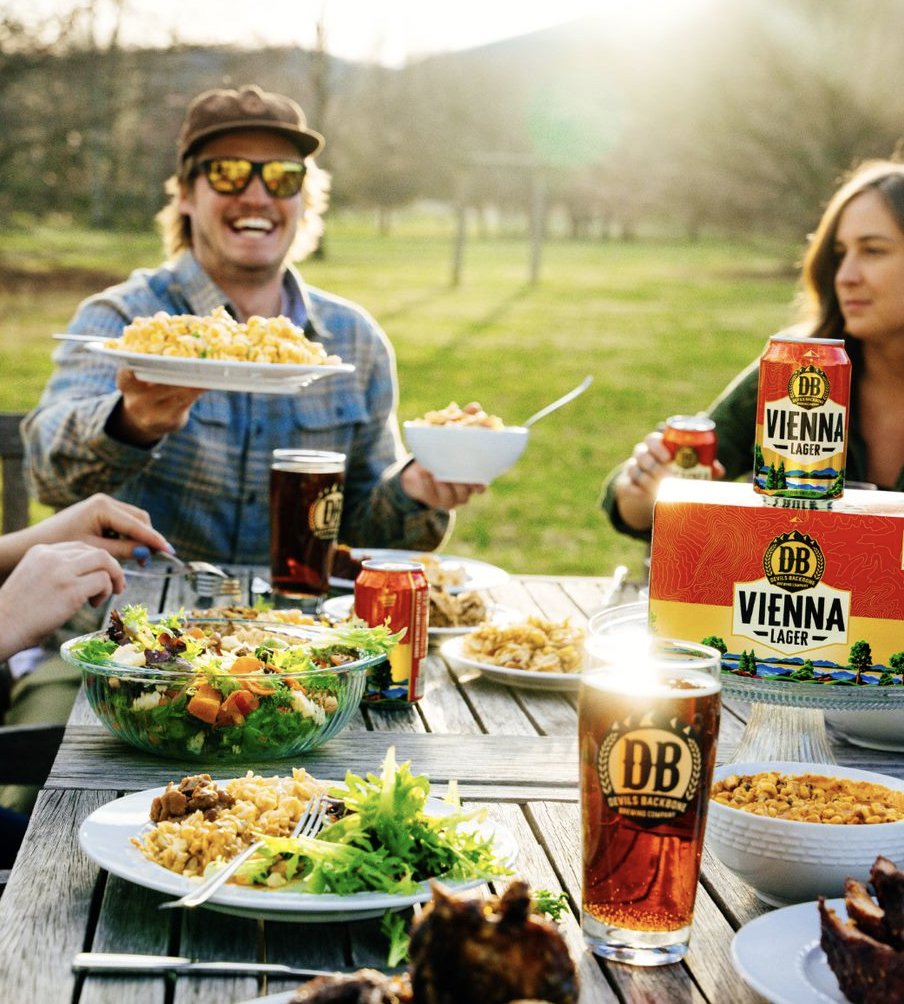 Guaranteed way to be invited to the cookout? Bring a beer that pairs well with everything. Vienna Lager - New look, still tastes like home. #ViennaLager #DevilsBackboneBrewingCompany #DrinkOutdoorsTogether #CraftBeer #Virginia #VirginiaCraftBeer