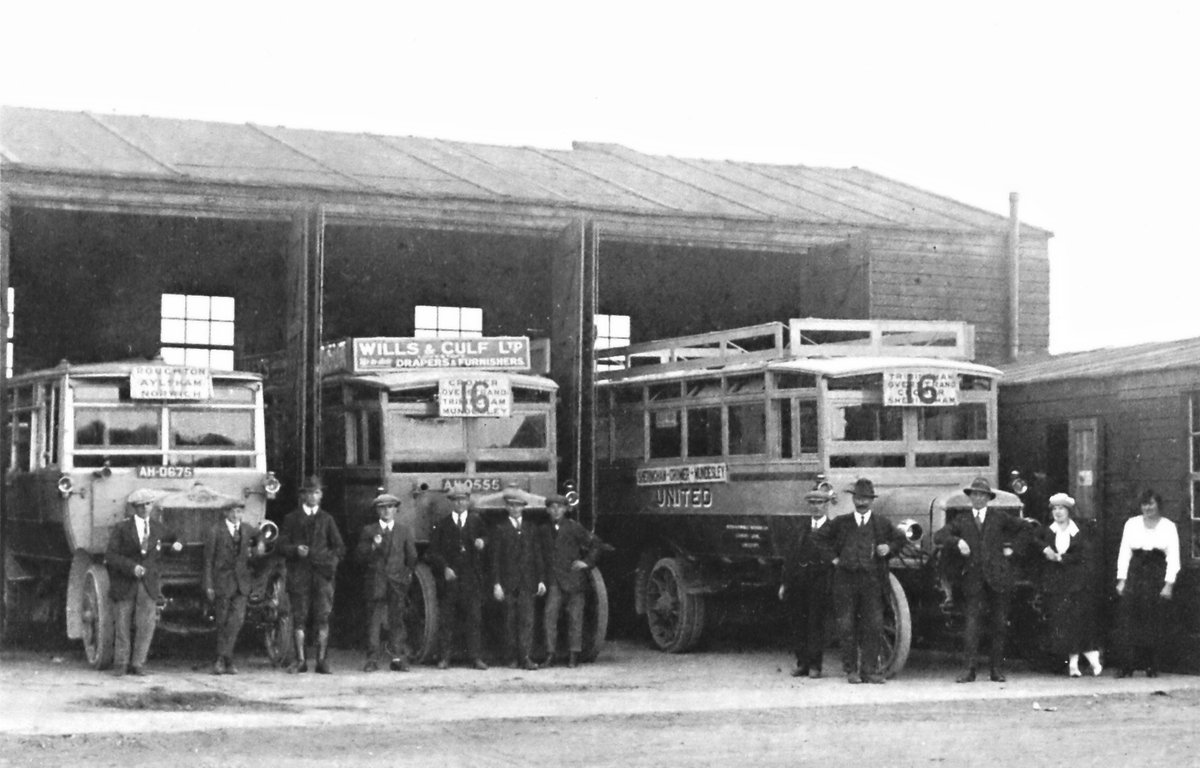 Cromer, North Norfolk, bus depot, 1919/20. Grandad Arthur Fisher with the flat cap in front of the RH bus. #ThrowbackThursday @CromerMuseum
