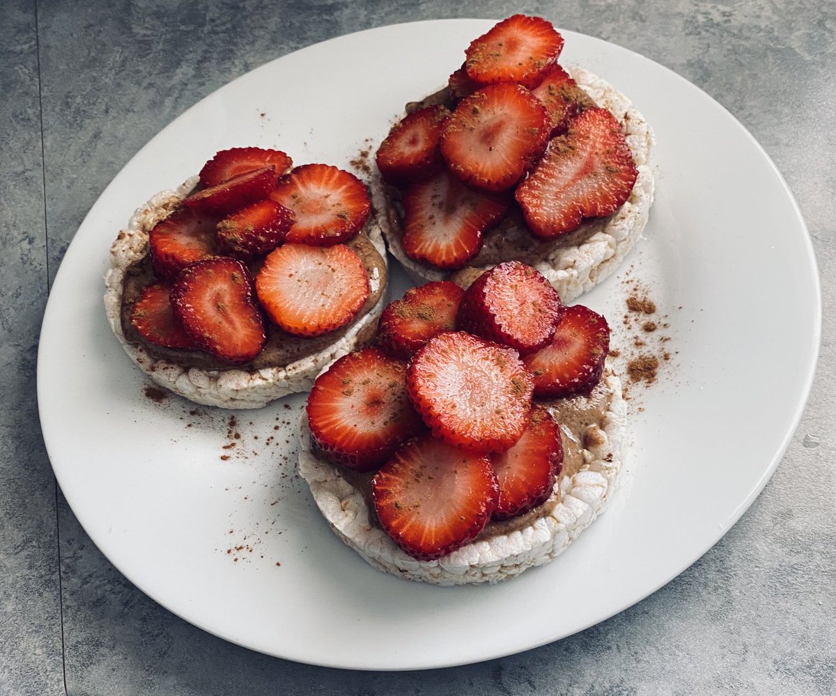 Strawberries piled on rice cakes with almond butter and cinnamon; don’t mind if I do. #springfeeling