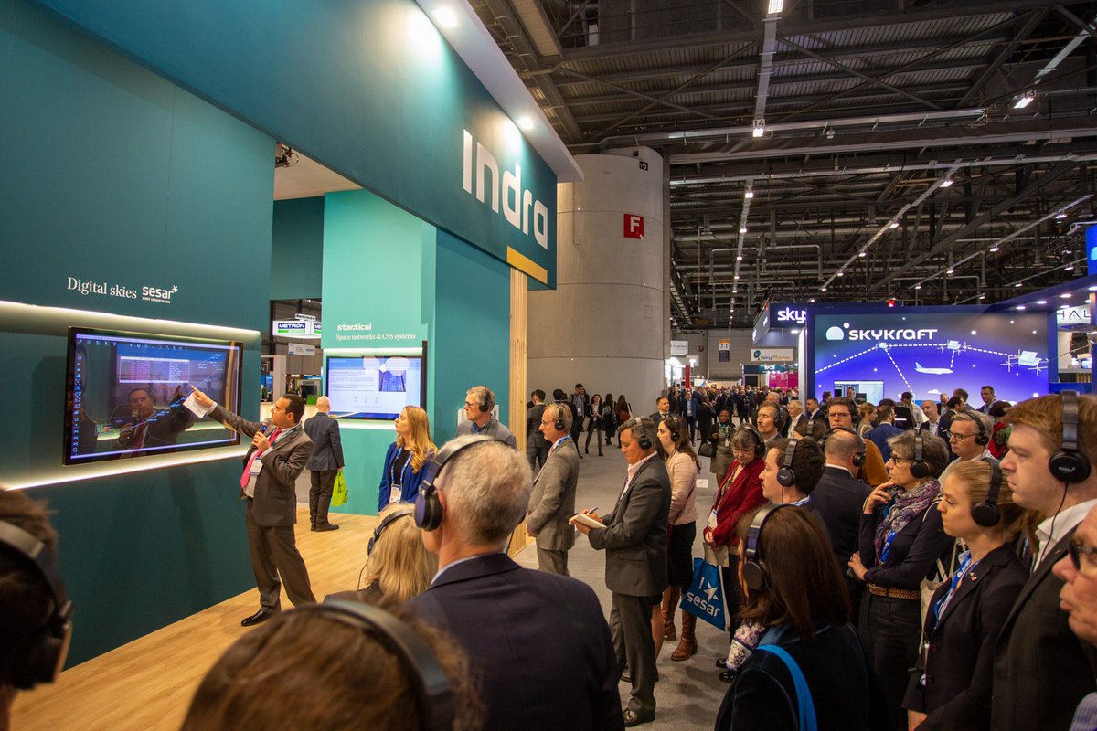 IndraCompany's tweet photo. Indra's booth was a stop for @SESAR_JU walking tour about sustainable trajectories presented by Manuel Martínez López in collaboration with @PANSA_PL related to ADSCENSIO - PJ38W3 project. 
#AirspaceWorld #ATM @AirspaceWorld https://t.co/z3MJ1a3J2s