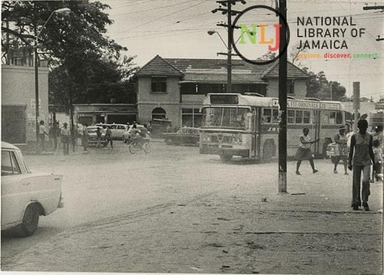 bujsha's tweet image. Is the Guango tree across from the Cross Roads post office on borrowed time too? 

Pics dated 48yrs apart: 1975-2023

We need a tree preservation order to protect this #legacytree
@nepajamaica @ksamcorp @jamentrust @matthewsamuda @ForestryDeptJa @islandcitylab @CitizensRightJA