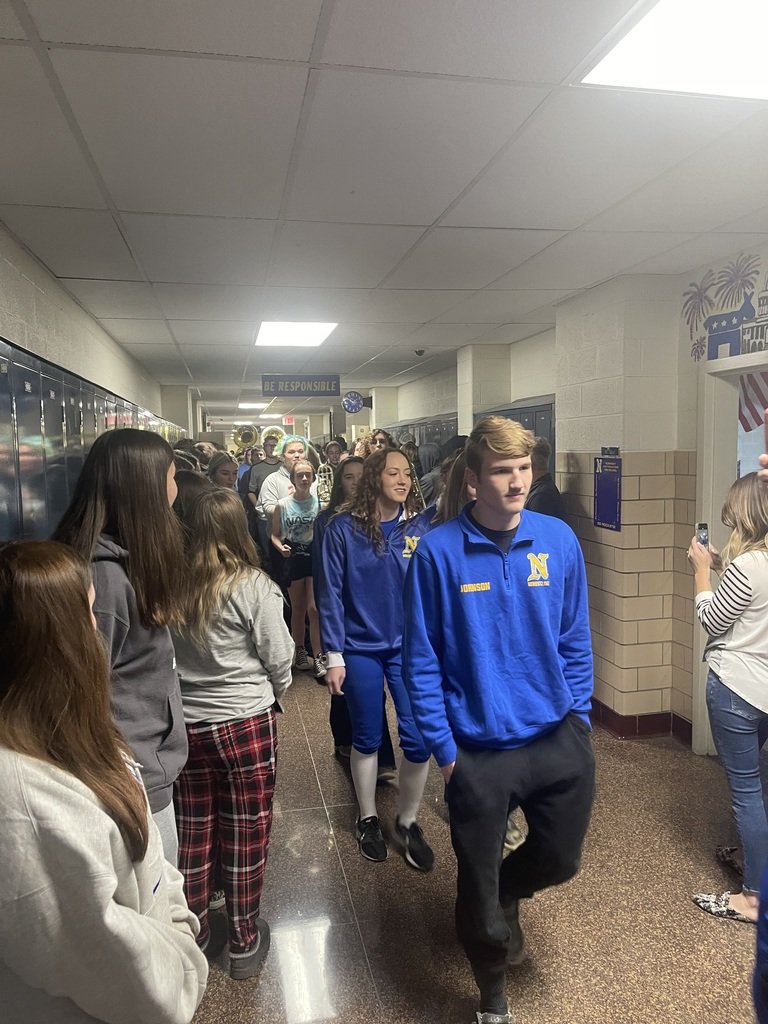 CNEHighSchool's tweet photo. The wrestlers competing in the State Tournament were escorted around the building by the Marching Rockets so our students could show their support. Good luck to our wrestlers who are competing this weekend! #RocketPride https://t.co/xDm2ohq81k