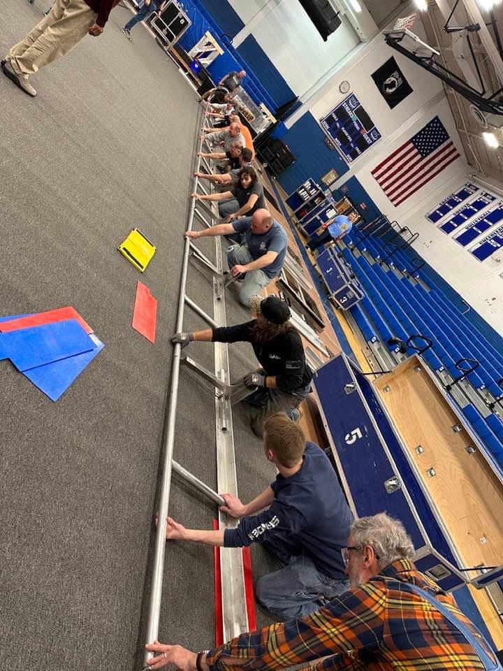 Here is Jacob and so many others working hard to setup for this weekend’s robotics competition. It takes an army. It is so exciting!!!  Stop by to support Team Impact if you can. Over 1,000 attendees a day are expected. Admission is free. 🤖