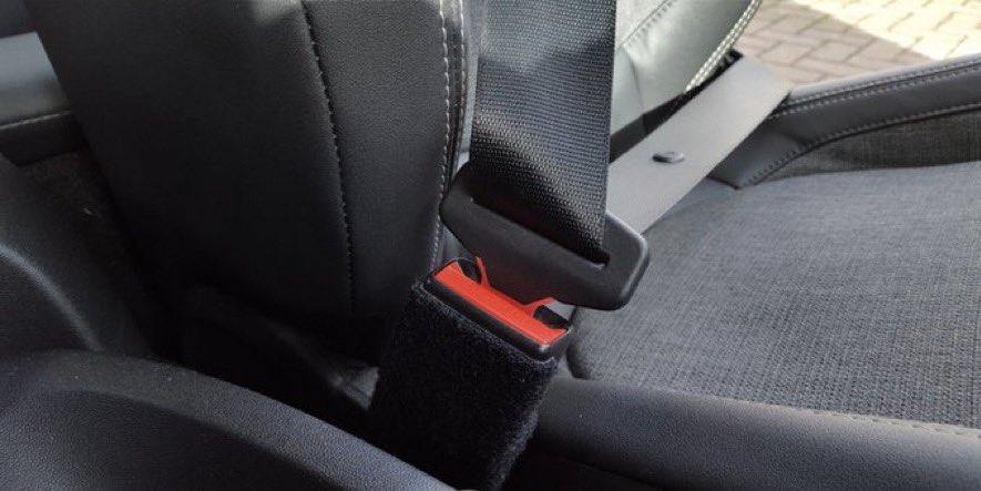 Connecting your seatbelt behind you to avoid the reminder tone is irresponsible.

Seatbelts are there to save lives. They can't do that if you don't use them.

Never wear a seatbelt under your arm or behind your back.