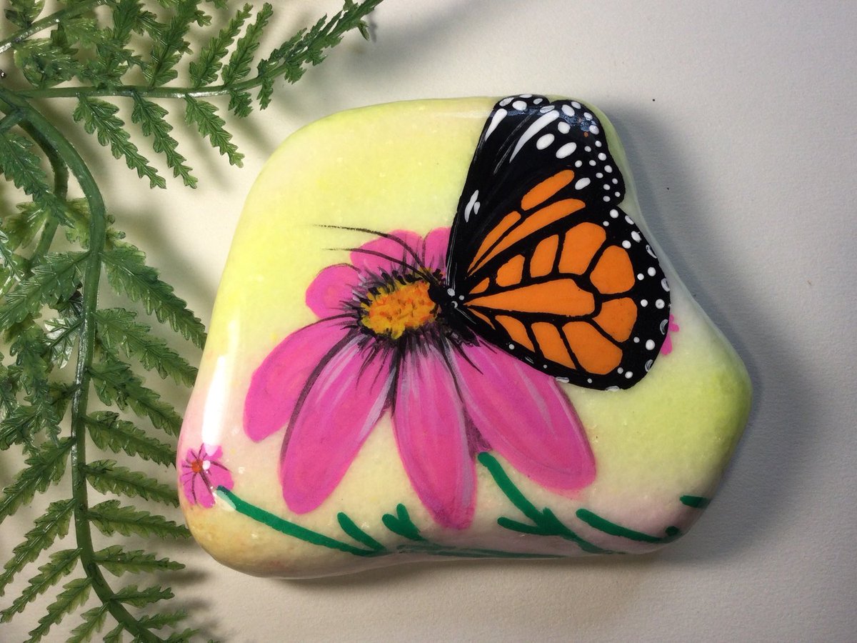 Karinasassa's tweet photo. Excited to share this item from my #etsy shop: Hand painted Monarch on Santorini stone, one of a kind rock art, pink yellow green daisy for home and garden indoor/outdoor garden art decor https://t.co/zp5EAPzW8a https://t.co/FcwH3QfYWa