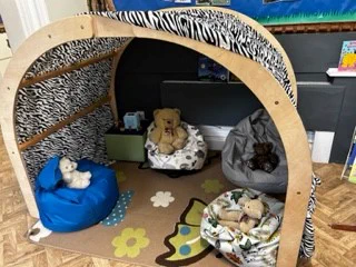 When all that outdoor learning exhausts children can enjoy a quiet space with a book or listen to a story on the Tomi