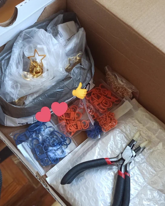 my charms are on the way to me! prepped my work station for assembly too! spot any new faces? :3 