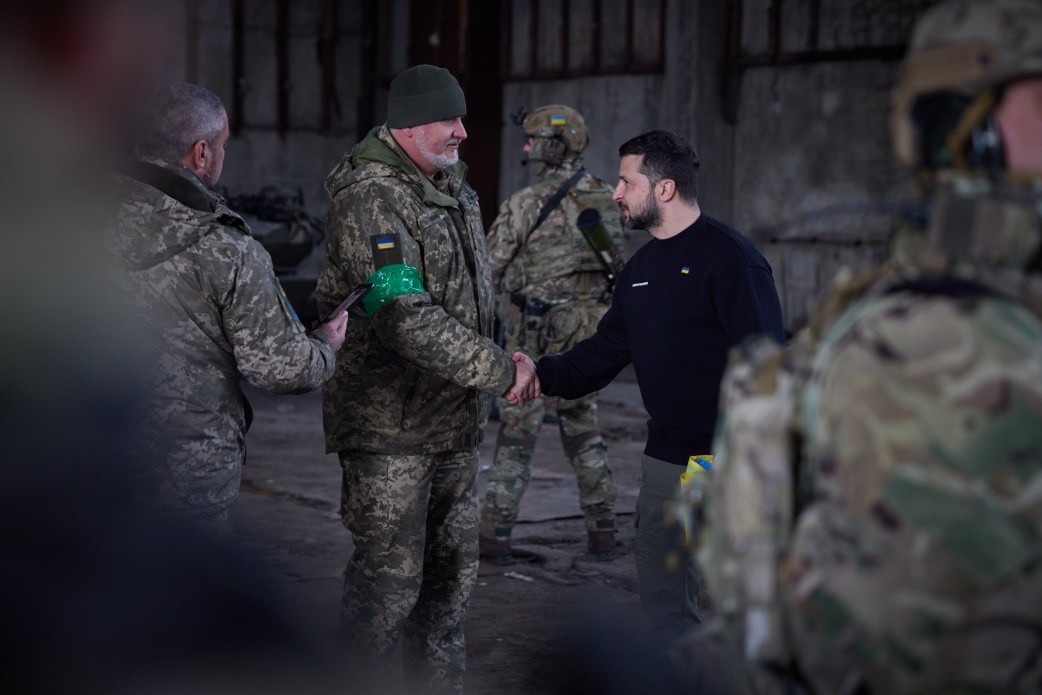 DefenceU's tweet photo. President @ZelenskyyUA visited frontline positions in the Donetsk region and awarded the defenders of Bakhmut. https://t.co/1uEAKtDg9n