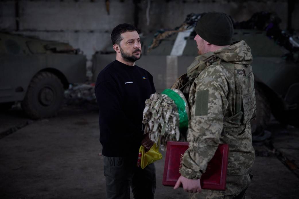 DefenceU's tweet photo. President @ZelenskyyUA visited frontline positions in the Donetsk region and awarded the defenders of Bakhmut. https://t.co/1uEAKtDg9n