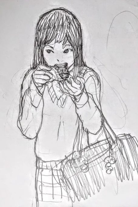 駅の売店で買ったレンガみたいなチョコレートを、バリバリ食べている高校生 