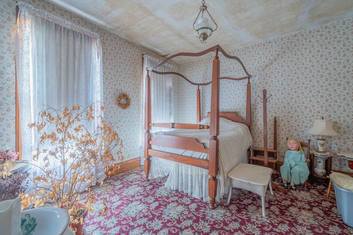 Abandoned bedroom with the creepiest doll I’ve ever seen