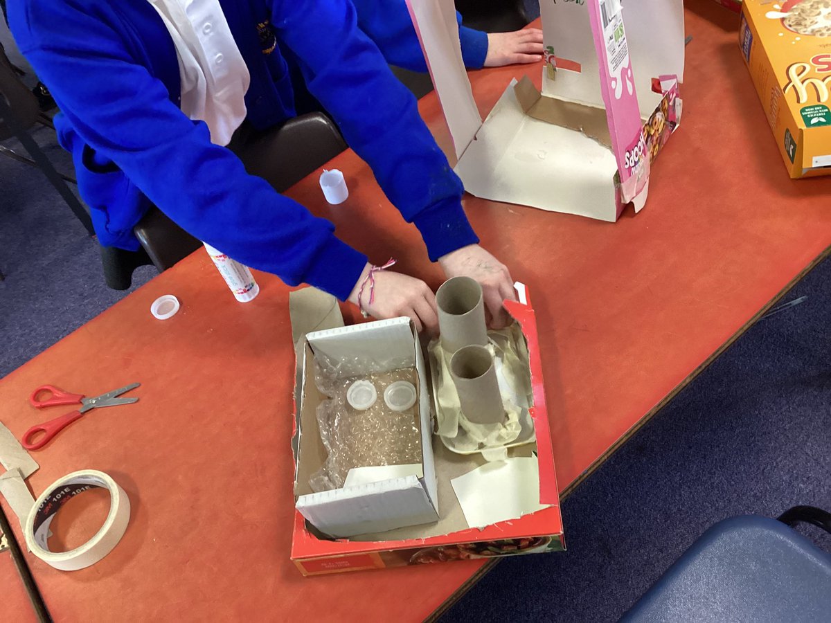 RavensdalePS's tweet photo. Resilience at its finest in year 2 this afternoon. Imagine being asked to design a state-of-the-art parrot enclosure for a pirate ship, and then being given a load of junk to bring it to life! Amazing creativity, cutting and joining skills year 2, well done. #RPSY2 #RPSDT https://t.co/qQ36kBU8U6