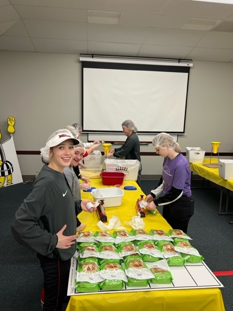 The EHS softball team packaged meals with The Outreach Program yesterday evening. This organization helps provide food, clean water, medical care and education across the globe. Way to give back EHS softball! We are grateful to have you as #PartOfThePride!