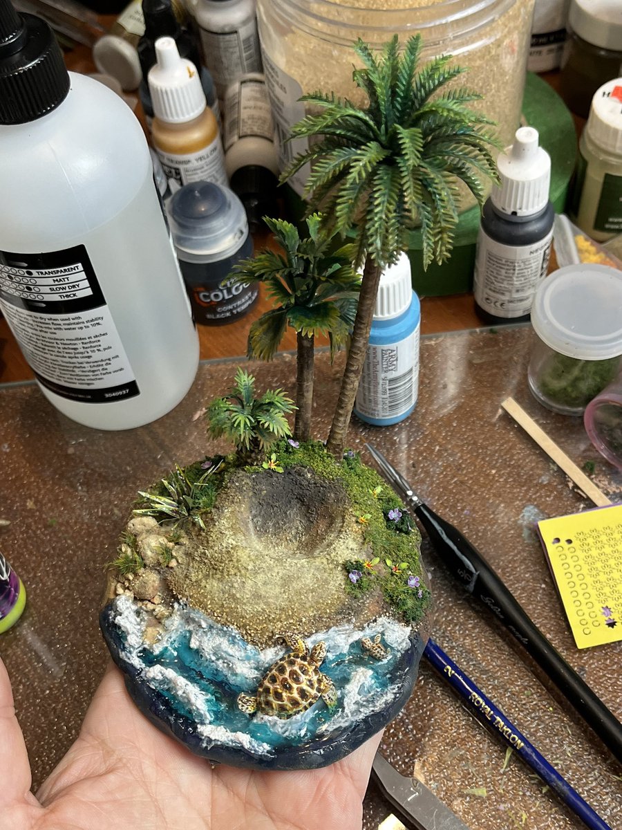 Nerfblat's tweet photo. @jackson_pope @codeNCardboard @Wojtowicz_N @rf_seattle @crazyhawkgames @ReflectiveTree @The_Prototyper @anarchytabletop @WingedFiveGames @amgsmith @BSoMT_2018 @JonTexMo @Raven_elf Happy #CraftWednesday! Did some more work on my Turtle Island #dicedisplay, adding foliage and greenery. Love the way itโs turning out. The @AMMOMIG laser cut plants are lovely to work with. Found itโs easier to paint the plants before removing them from the sheet. ๐ https://t.co/dKGYSVzLYn