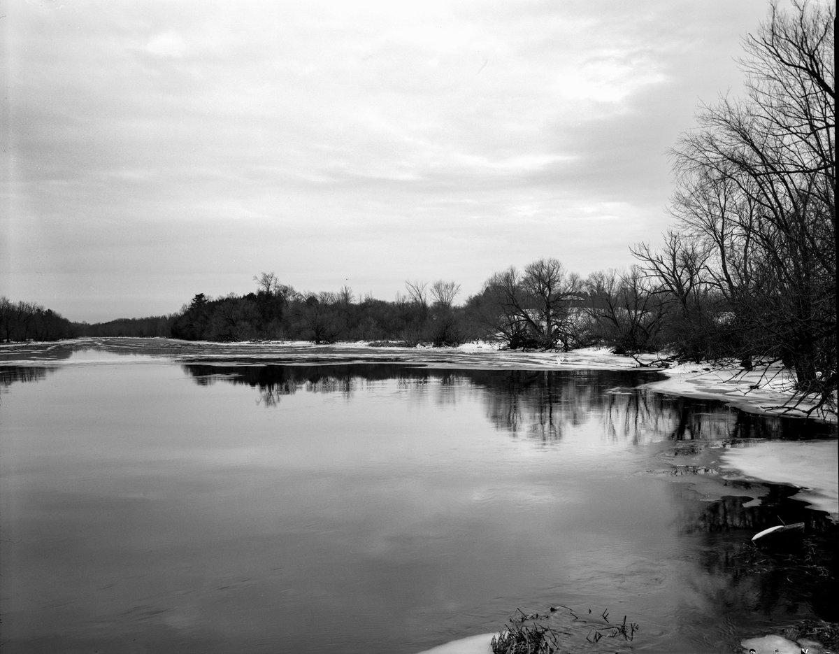 Ian Austen (@ianrausten) on Twitter photo 2023-03-22 22:28:36 The Ottawa Valley's Mississippi River viewed from a soon-to-be-replaced single-lane bridge at Blakeney, Ontario. This is from early December during winter's slow start. It's now in no hurry to leave. (Deardorff 8x10, 240mm f5.6 Nikkor W, @KodakProFilmBiz TXP 320) The Ottawa Valley's Mississippi River viewed from a soon-to-be-replaced single-lane bridge at Blakeney, Ontario. This is from early December during winter's slow start. It's now in no hurry to leave. (Deardorff 8x10, 240mm f5.6 Nikkor W, @KodakProFilmBiz TXP 320)